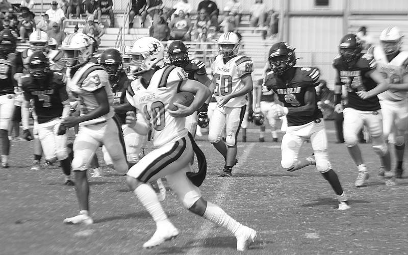 Pine Prairie quarterback Cayden McCollough (10) finds room to run in the Panthers’ game at Oberlin Saturday morning. McCollough, unofficially, ran for 100 yards on eight carries and scored a touchdown. (LSN photo by Tony Marks)