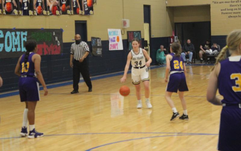 Taylor Darbonne (34) takes the basketball down the court in Sacred Heart’s home win against Opelousas Catholic. (Gazette photo by Rhett Manuel)