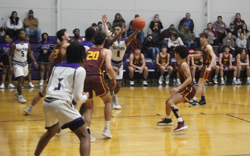 Davontae Fontenot (0) tries to maintain possession of the basketball in Ville Platte’s home game against Iota last Friday night. (Gazette photo by Rhett Manuel)