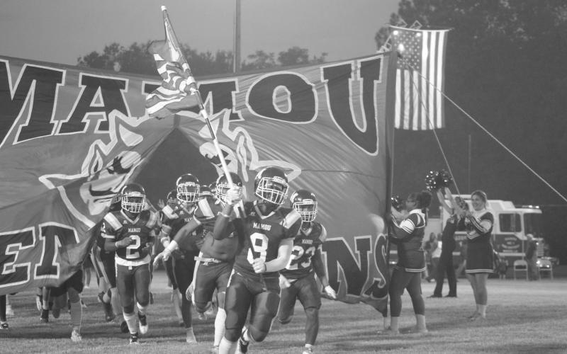 The Mamou Green Demons take the field on homecoming night last week against Ville Platte High. This week, the team took one on the chin against Oakdale, 64-30. (Gazette photo by Sylis Manuel)