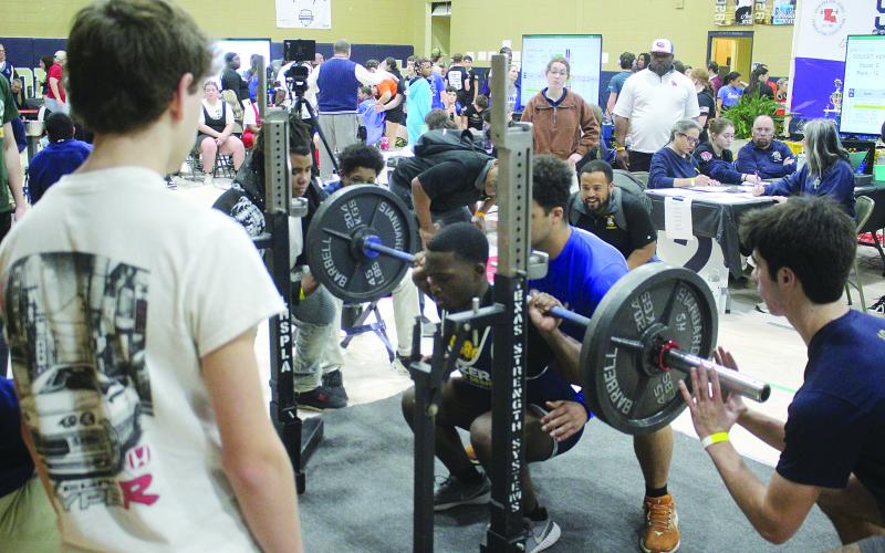 Kendarius Doucet, of Ville Platte, is pictured as he attempts a squat during the invitational held Saturday, January 10. He competed in the 165 weight class with a total of 720 pounds. (Gazette photo by Tony Marks)