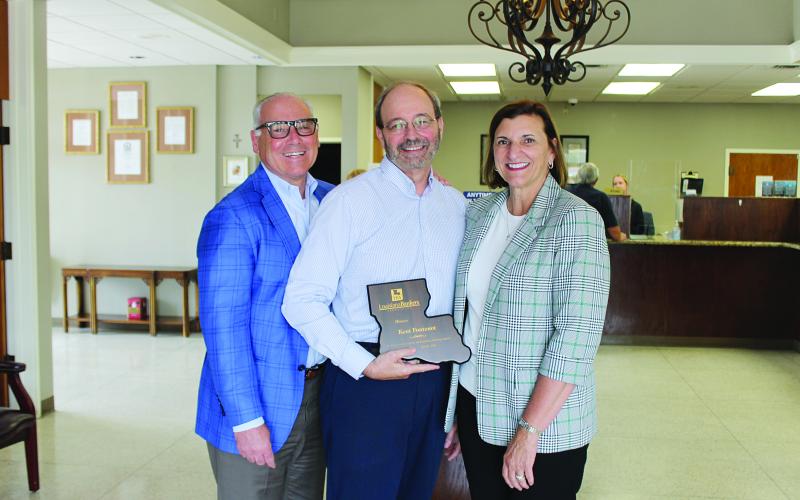 From left are John D’Angelo, Investar CEO/president; Kent Fontenot, Mamou branch manager; and Ginger Laurent, Louisiana Bankers Association chief executive officer. (Gazette photo by Kathy Longino)