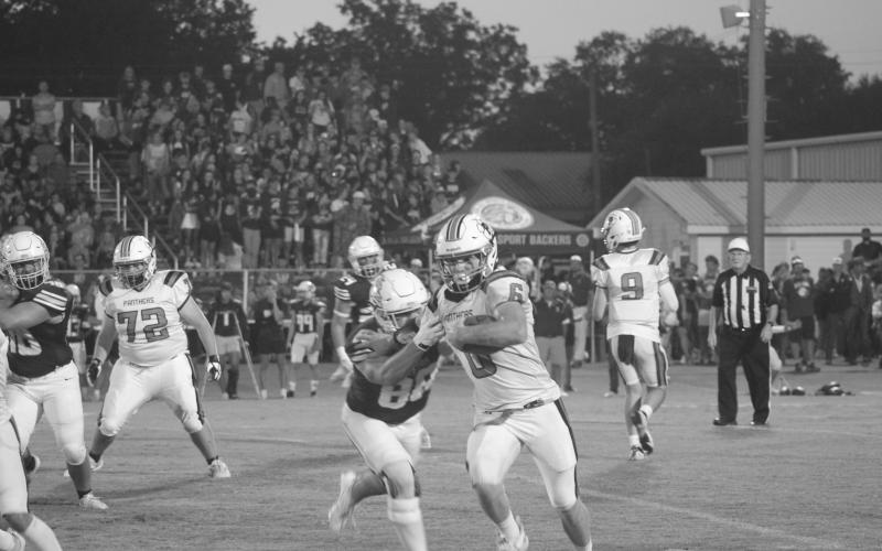 Pine Prairie’s Caden Askey (6) is pictured as he gains 14 yards in the first quarter. His run helped set up a Panther touchdown to begin the second quarter against the Iota Bulldogs. (Gazette photo by Tony Marks)