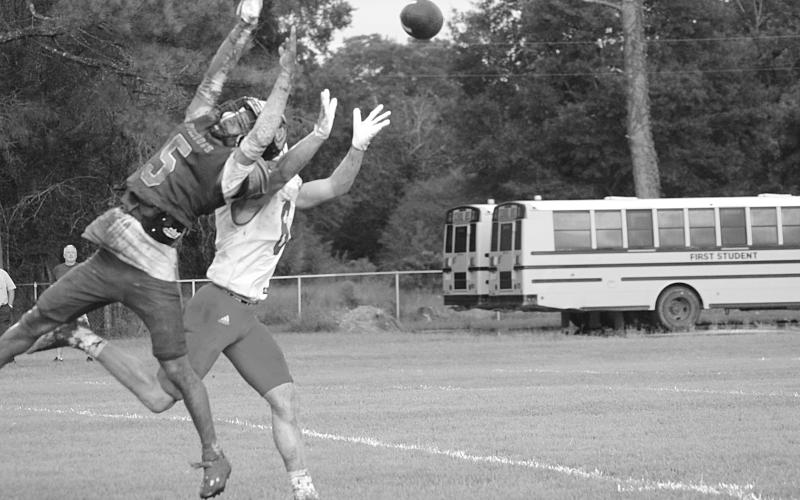 Ville Platte High’s Greg Guillory (5) breaks up a pass intended for Basile’s Parker Fontenot (6) in the Bulldogs’ 6-0 in the Evangeline Parish Jamboree at Pine Prairie Friday night. (Gazette photo by Sylis Manuel)