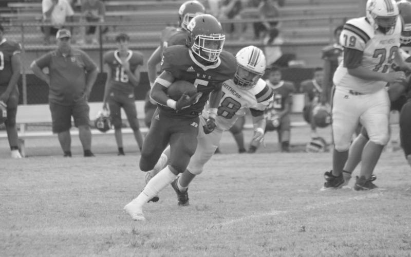 Bryan Hardy (5) outruns a Pine Prairie defender in Basile’s 7-0 win over Pine Prairie in the jamboree. (Gazette photo by Rhett Manuel)