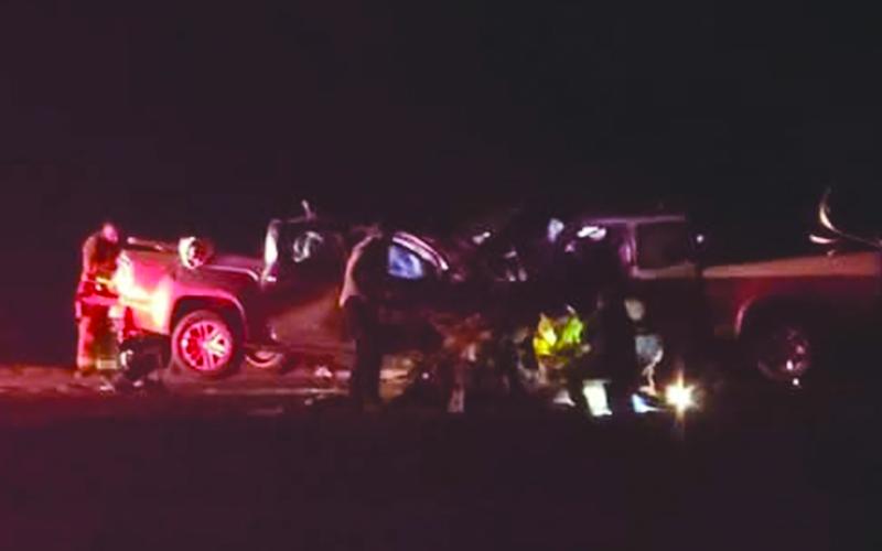NEW YEAR’S ACCIDENT - Only flashlights and headlights show the results of  the January 1  head-on collision on Highway 190 just east of the Basile town limits.