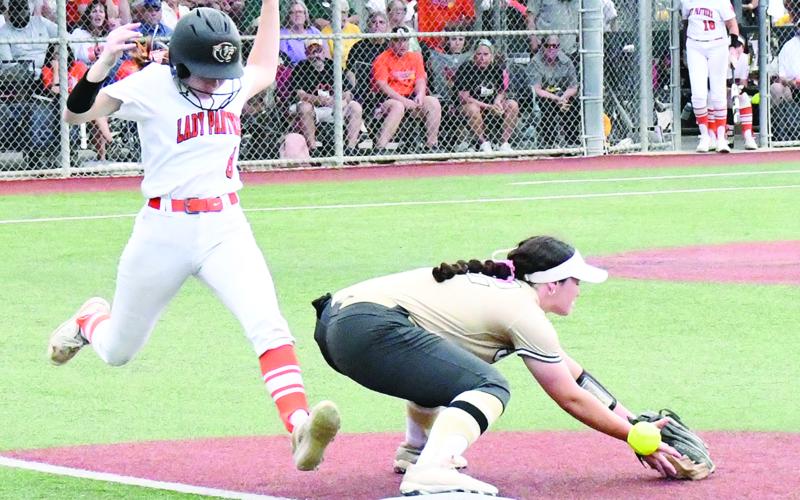 Macy (M.J.) Chauvin (8) legs out a single in Pine Prairie’s 3-2 loss to Jena in the softball state semifinal game. She had two of her team’s four hits. (Photo by Craig Franklin)