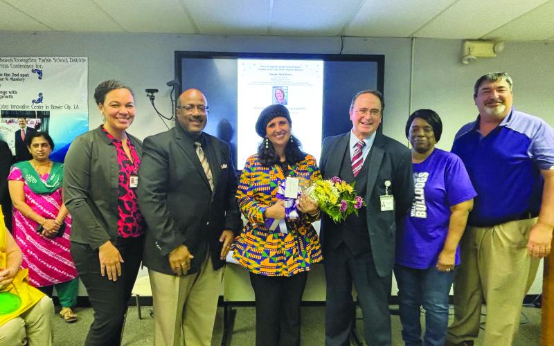 Middle School District Teacher of the Year Jessica Capseta (center) poses with, from left, VPE Principal Katrina Ardoin, Superintendent Darwan Lazard, Assistant Superintendent Mike Lombas, former School Board Vice President Wanda Skinner, and former School Board President Michael Fontenot.  (Gazette file photos)