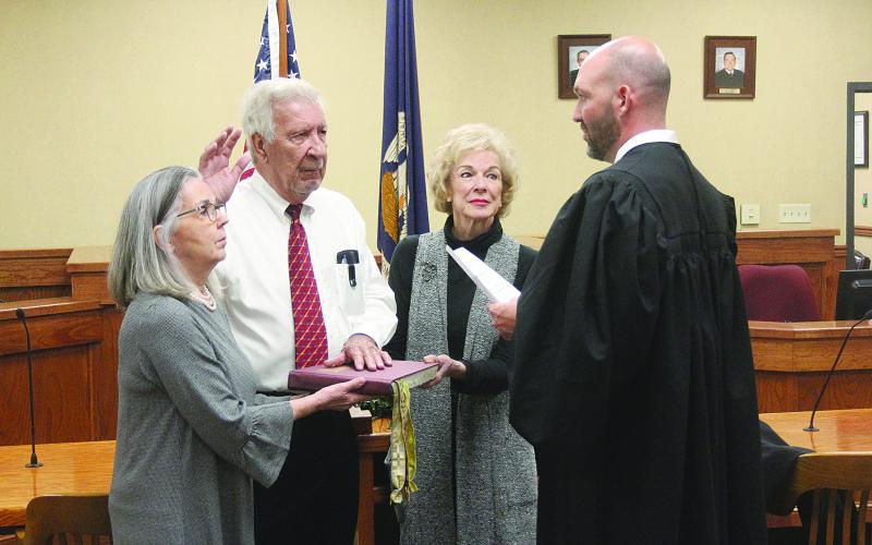Pictured is Ville Platte City Court Judge Gregory Vidrine (right) as he swears in his father Judge John Larry Vidrine (second from left) as judge on the Third Circuit Court of Appeal to replace the late John Saunders. Also pictured are Melanie Vidrine (left) and Susan Saunders (second from right). (Gazette photo by Tony Marks)