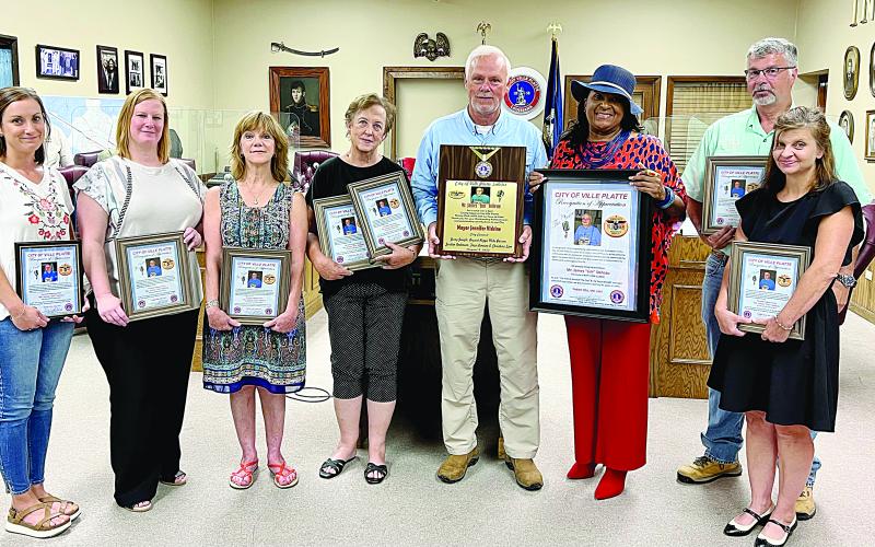 Pictured from left are Ali Deville, Becky Fontenot, Jamie Vidrine, Cathy McDaniel, Kirk Soileau, Mayor Jennifer Vidrine, Jessica Soileau, and Kyle Soileau. (Gazette photo by Nancy Duplechain)
