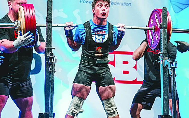 Liam Kincanon, a junior student at Sacred Heart, is pictured as he competes at the IPF/NAPF North American Regional Championships in St. John’s Newfoundland and Labrador, Canada, where he won four gold medals and set a record in squats. (Photo courtesy of Kayla Kincanon)