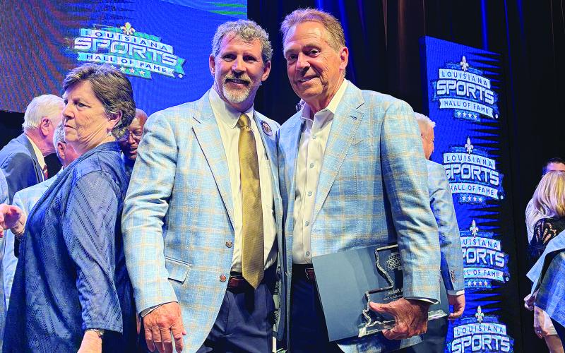 Robert Soileau (left) is pictured with LSHOF inductee Nick Saban on stage following the induction ceremony held Saturday, June 28, in Natchitoches.  (Gazette photos by Tony Marks)