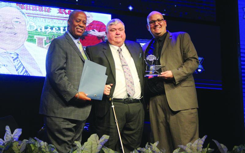 JUNE 30 - From left are State Senator Gerald Boudreaux, Distinguished Service Award recipient Garland Forman, and Louisiana Sports Writers Association President Raymond Partsch III.