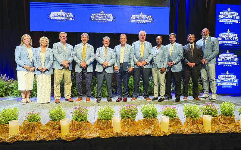 The 2025 Louisiana Sports Hall of Fame induction class (left to right): Robin Daniels representing DSA winner Ed Daniels, April Burkholder, DSA winner Glenn Guilbeau, Robert Soileau representing George “Bobby” Soileau, Danny Brousard, Nick Saban, Joe Scheuermann, Vickie Johnson, Dave Dixon Louisiana Sports Leadership Award winner Herb Vincent, Neil Weiner representing Dale Weiner, and Andrew Whitworth. (Gazette photo by Tony Marks)