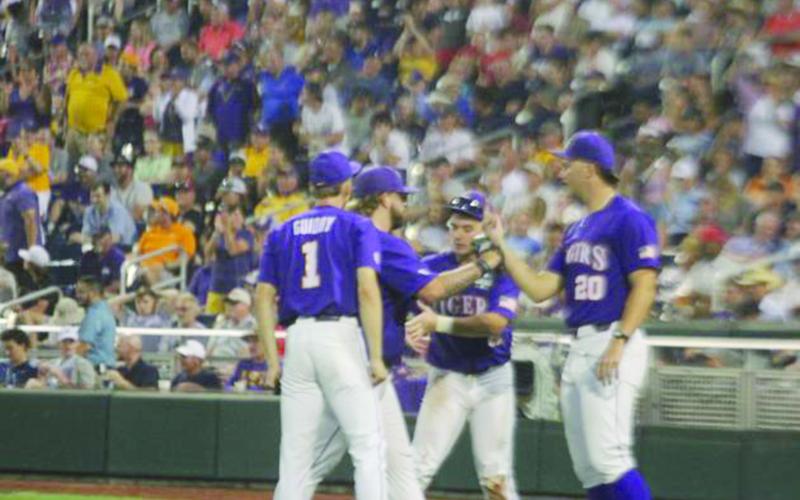 Paul Skenes (right) congratulates Riley Cooper (left) on earning a save in the Tigers’ opener.