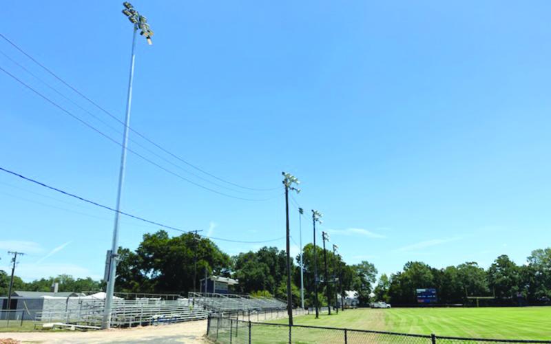 Pictured in the left and right photos are the newly installed lights at Soileau-Landry Field during the day and the night. (Photos courtesy of Kimberly Lejeune)