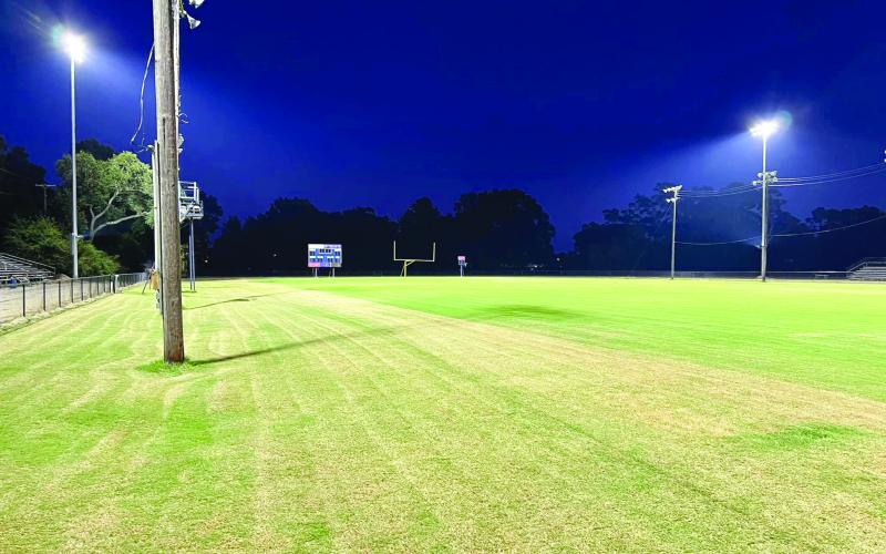 Pictured in the left and right photos are the newly installed lights at Soileau-Landry Field during the day and the night. (Photos courtesy of Kimberly Lejeune)