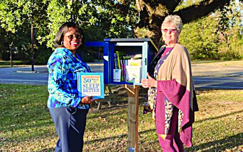 Pictured with the Little Free Library are Yvonne Lavergne, director, and Suzy Lemoine, outreach coordinator. (Photo courtesy of Suzy Lemoine)