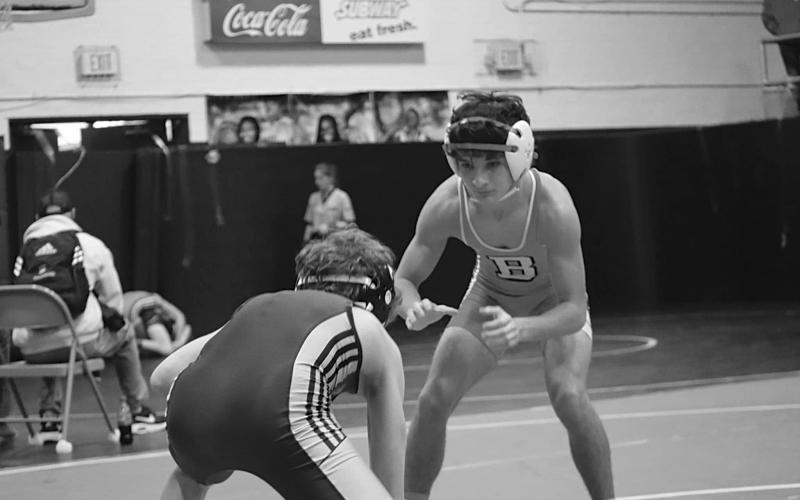 Logan Bergeron, State Champ at 106 lbs., is shown in action.