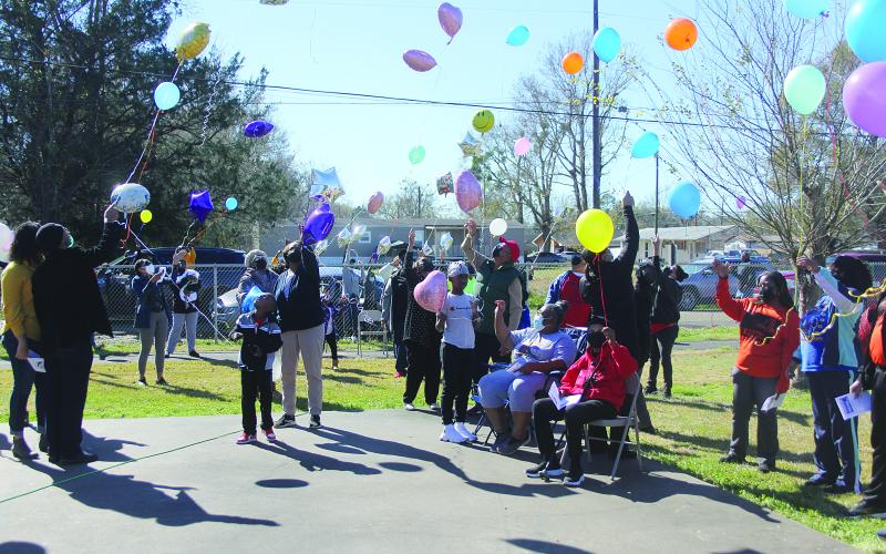 A balloon release takes place during the annual Martin Luther King Jr. Memorial Celebration held Monday, January 17, in Ville Platte. Among those pictured are Ville Platte Mayor Jennifer Vidrine, Assistant District Attorney Betsy Jackson and her mother, Beatrice, and Brian and Katrina Ardoin . (Gazette photo by Tony Marks)
