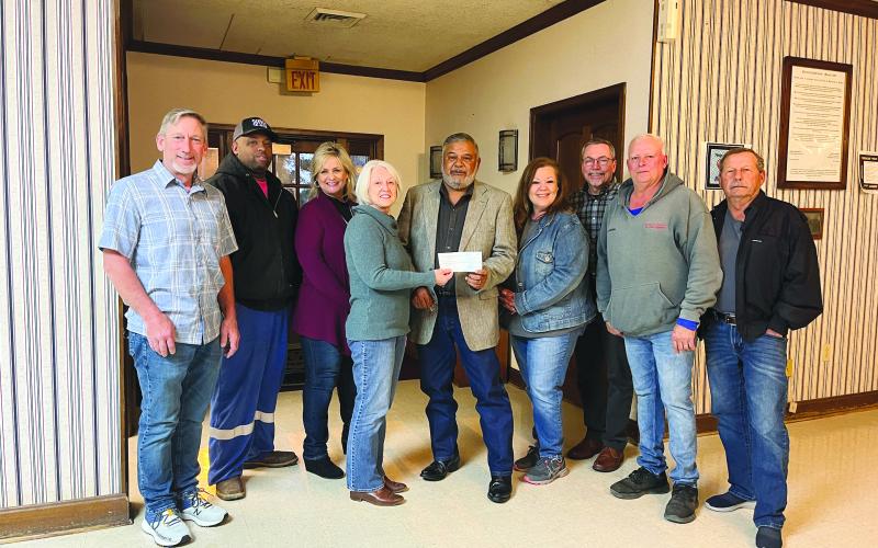 DONATION PRESENTED - Dr. Gwen Fontenot and Connie Lamke presented a donation from the Acosta Foundation to the Mamou Town Council during the board’s monthly meeting held March 9. The funds will be used for the purchase of mulch to be spread at the town’s two parks. Shown, from left, are council members Robin Young, Derrell Thomas, Leisa Deshotel, Dr. Fontenot, Mayor Ricky Fontenot, Lamke, Clerk Guy Pucheu, and council members Brook Chapman and Charles Reed. (Gazette photo by Heather Bogard)