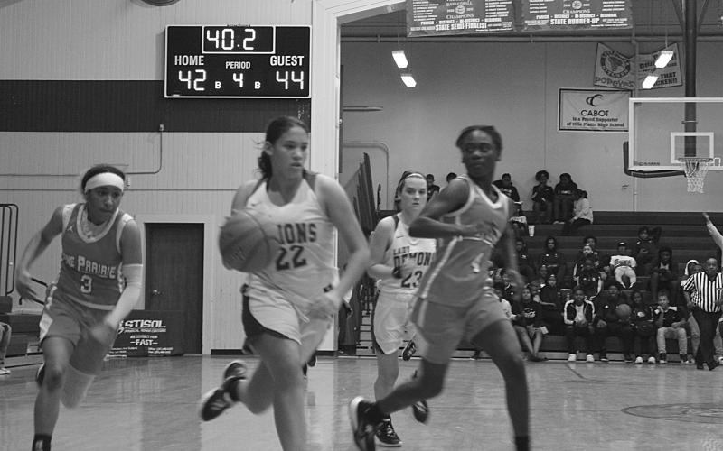 Mamou’s Maddie Fontenot (22) outruns a pair of Pine Prairie defenders as the two teams play in the parish tournament held at Ville Platte High School earlier this month. (Gazette photo by Rhett Manuel)