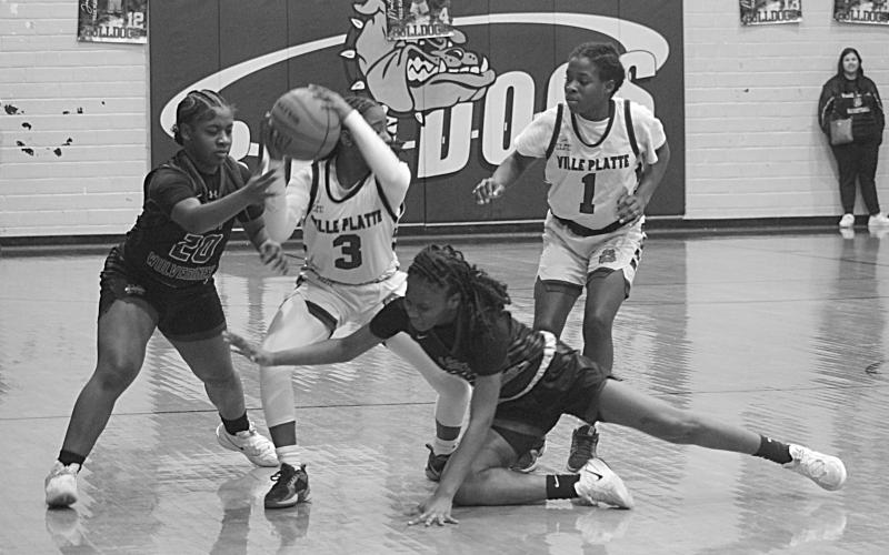 Yazminn Ardoin (3) tries to maintain possession of the basketball in the Ville Platte Lady Bulldogs’ playoff loss to the Mansfield Lady Wolverines on Monday night. (Gazette photo by Sylis Manuel)