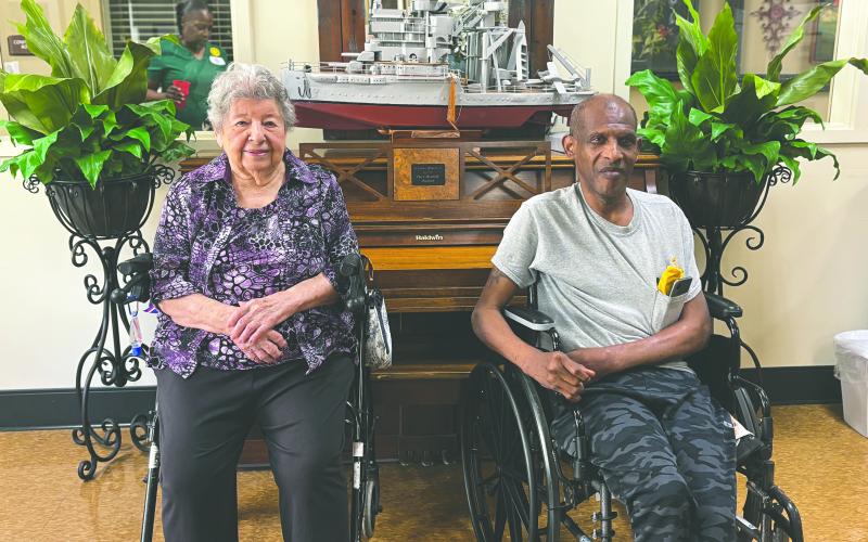 LA REINE ET LE ROI ENJOYED REIGN - Heritage Manor’s king and queen of the Cotton Festival, Le Roi Clanis Freeman (right) and La Reine Mary Sylvia Veillon (left) shared their enjoyment of their reigns. (Gazette photo by Heather Bogard)