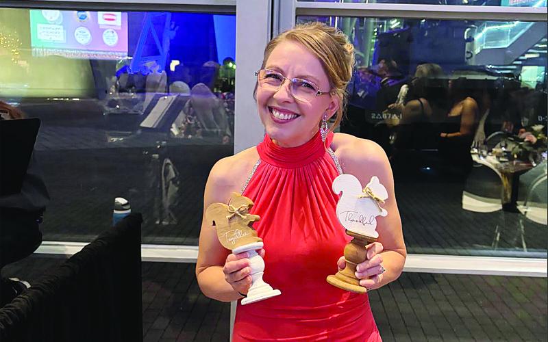 Melanie Soileau, of James Stephens Montessori, is pictured with some of her gifts at the awards gala in New Orleans. (Photo courtesy of Grace Sibley)