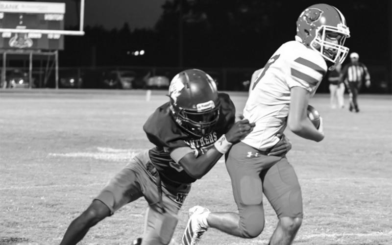Landon Fontenot gets away from a Merryville defender. (Photo by Tonya Ortego)