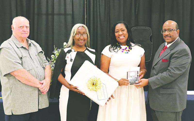 (L-R) Bobby Hamlin, president of the Evangeline Parish School Board; Lisa Celestine, principal of Mamou Junior High; Monseeta Richard, middle school teacher of the year; and Darwan Lazard, superintendent. (Photos courtesy of Tone Tezeno)
