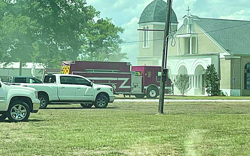 Pictured is a fire unit parked in front of Our Lady of Mount Carmel Catholic Church in Chataignier. The church sustained minor damages from an electrical fire on Sunday, September 3.  (Photo courtesy of Keith Guillory)