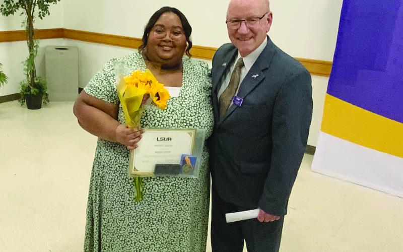 Madisyn Nelson (on the left) is pictured with Dr. Paul Coreil Chancellor of LSUA (on the right). (Photo courtesy of Madisyn Nelson)