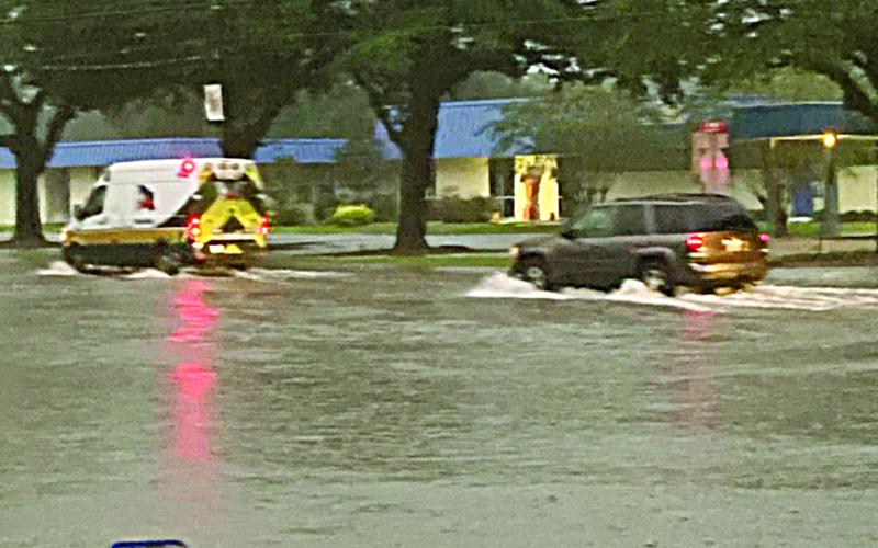 Pictured is a flooded intersection of East Main Street and LaTour Street across from Sacred Heart High School on Thursday evening. The flooding was caused by 6 to 8.5 inches of rain that fell on the area from Tropical Storm Nicholas. (Photo courtesy of Suzy Lemoine)