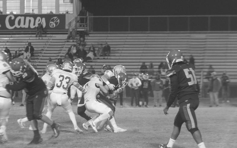 Sacred Heart defenders combine for a stop against North Central in Thursday’s Trojan win against the Hurricanes. (Gazette photo by Rhett Manuel)