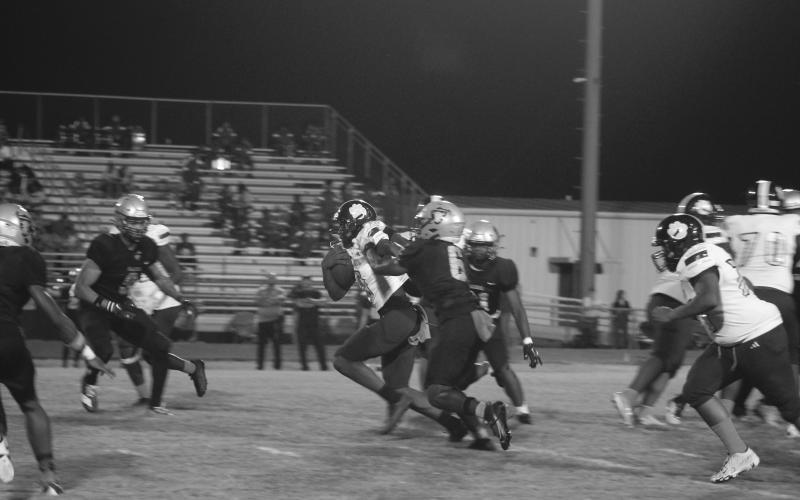 Ja’maury Thomas (0) shakes off a would be Northwest tackler as he fights for additional yardage in Ville Platte’s road district loss to Northwest, 42-0, last Friday night. (Gazette photo by Tony Marks)