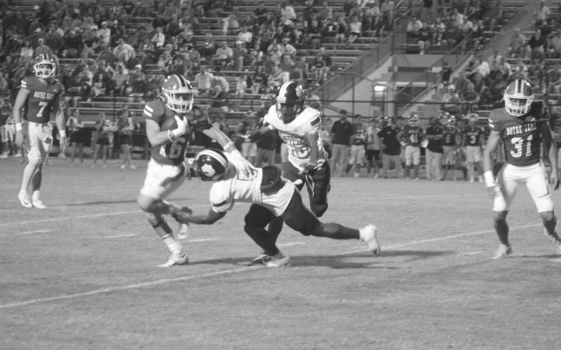 Damarion Oneail (5) makes a tackle against a Notre Dame runner. (Gazette photo by Tony Marks)