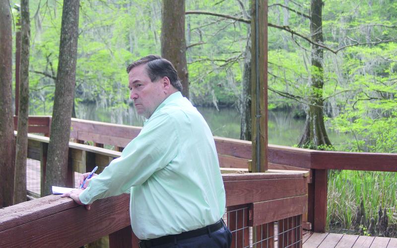 This picture of Lieutenant Governor Billy Nungesser jotting down ideas while peering over Lake Chicot from the pier located near the group cabins of Chicot Park earned Ville Platte Gazette editor Tony Marks a first place award in Best News Photo in the 2023 Better Newspaper Competition. (Gazette file photo)