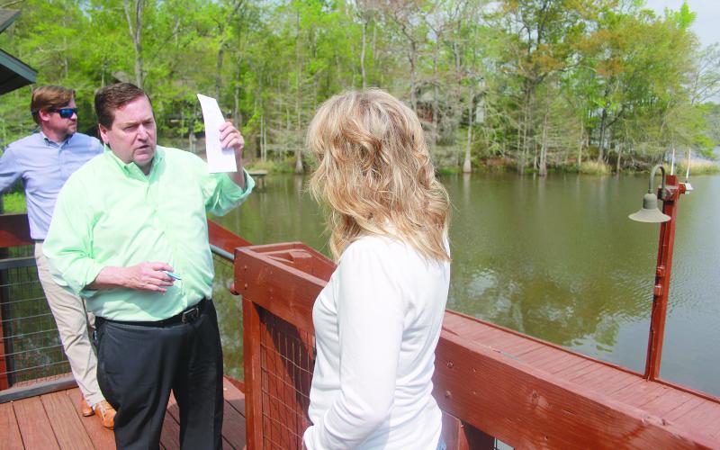 Lt. Gov. Nungesser (center) shares ideas with State Senator Heather Cloud (right) outside Cabin 3. (Gazette photo by Tony Marks)