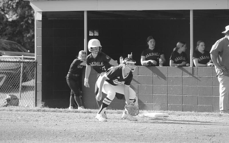Sacred Heart’s Emily Ardoin (10) holds Oakdale’s Aldyn Hebert (17) on the first base bag. (LSN photo by Tony Marks)