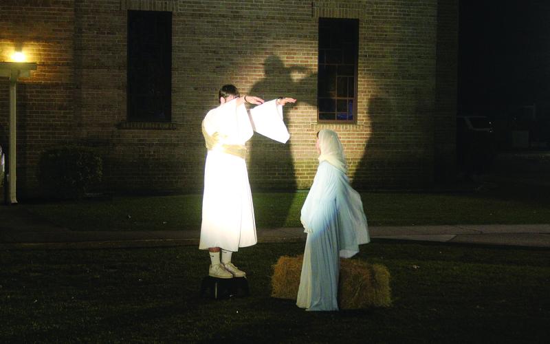 In the bottom photo are Briggs Ardoin as the angel Gabriel and Kirstyn Ardoin as the Virgin Mary. (Gazette photos by Tony Marks)