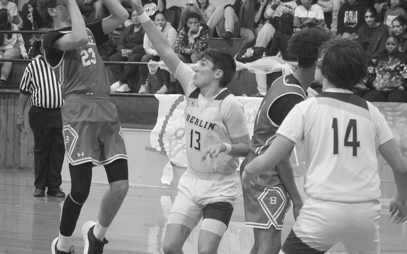 Wes Matt (23) gets off a basket for Basile as he is being guarded by Oberlin’s Kole Sonnier (13). (Gazette photo by Tony Marks)