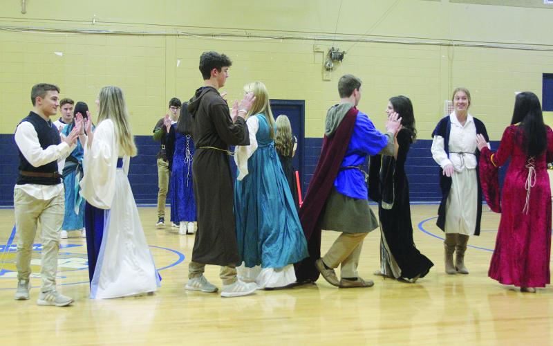 Members of Dorie Ardoin’s world history class at Sacred Heart perform a renaissance dance in the school’s gymnasium during an Open House held Wednesday, November 30. (Gazette photo by Tony Marks)