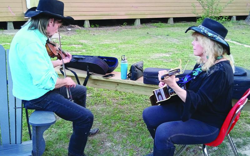 Pat and Cindy Onire, of Mississippi, are pictured playing their instruments during the Balfa Week celebration. The week was not only about music but also featured crafts, food, workshops and more. (LSN photo by Bobby Ardoin)