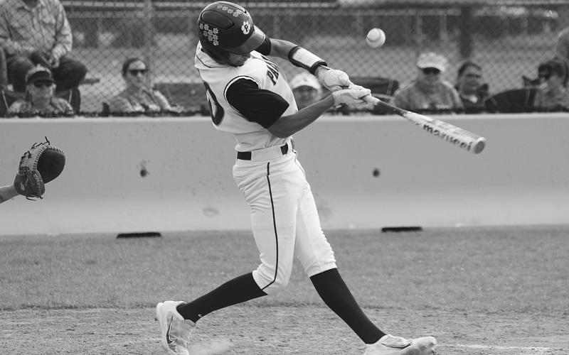 Evan Ardoin (20) fouls off a pitch in Pine Prairie’s playoff win against Port Allen. The Panthers earned a sweep on Thursday and now face Rosepine. (Gazette photo by Rhett Manuel)