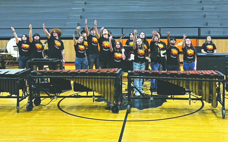 PPHS PERCUSSION ENSEMBLE SHOWS OFF TALENT - The PPHS Percussion Ensemble raises their hands at the close of their performance of their show “Steps to the Horizon.” (Gazette photo by Heather Bogard)