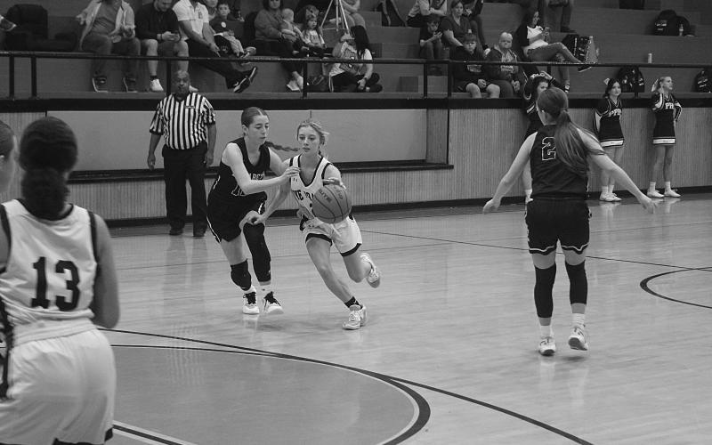 Alexis Folse (2) brings the basketball down the court for her Pine Prairie Lady Panthers in a 65-6 loss to Elizabeth Tuesday night. (Gazette photo by Tony Marks)