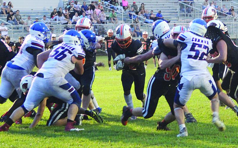 Elijah George (2) finds a running lane for his Pine Prairie Panthers as the team played Lake Arthur in a scrimmage Thursday night. He scored a pair of touchdowns in the Panthers’ 14-13 win during the scored portion. (Gazette photo by Rhett Manuel)
