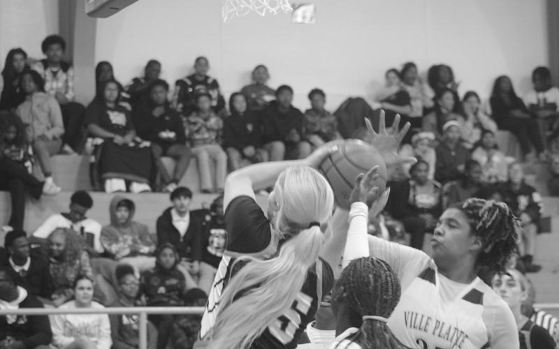 Ville Platte’s Toni Falkenberry (35) attempts to block a shot from Pine Prairie’s Jolie West (15)