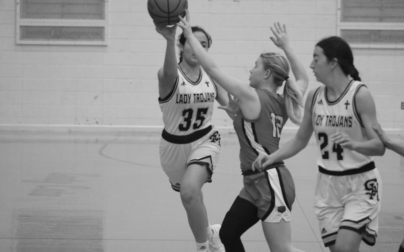 Sacred Heart’s Mary Perron (35) is able to get off a pass in the Lady Trojans’ 66-12 win over Basile to begin the parish tournament.